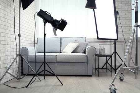 Photo studio with modern interior and lighting equipmentの写真素材