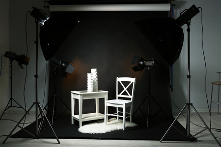 Photo studio with modern interior and lighting equipmentの写真素材