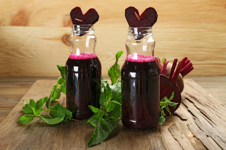 Fresh beet juice on wooden table, closeupの写真素材