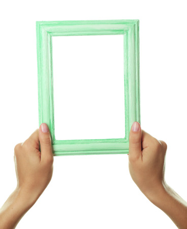 Female hands with wooden frame, isolated on whiteの写真素材