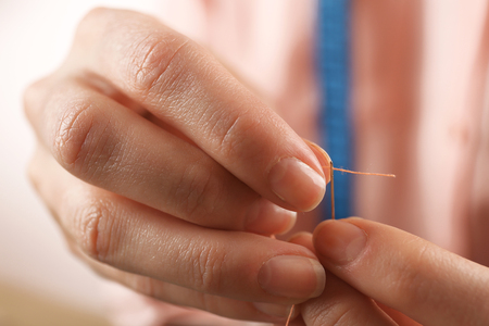 Closeup hands of seamstress at work