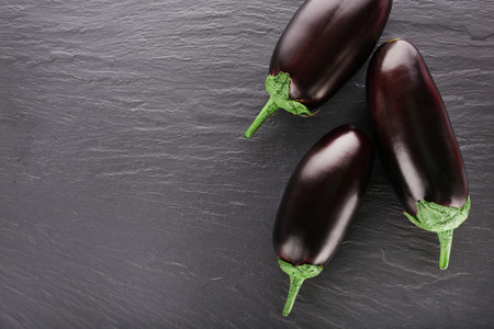 Fresh eggplant on wooden backgroundの写真素材
