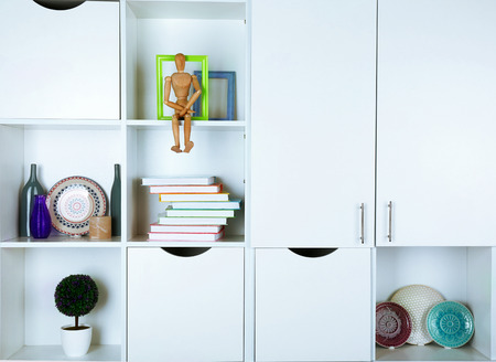 Beautiful white shelves with different home objectsの写真素材