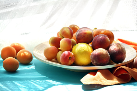 Heap of fresh fruits on windowsillの写真素材