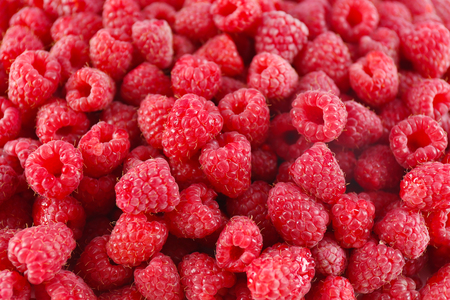 Heap of sweet red raspberries close upの写真素材