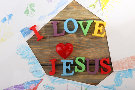 I LOVE JESUS sign illustrated with colorful plastic letters on drawings backgroundの写真素材