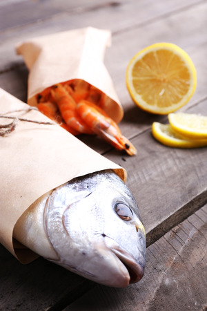 Dorado fish and other ingredients on wooden table, closeupの写真素材
