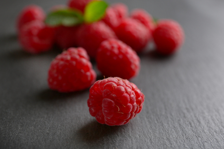 Fresh red raspberries on wooden table, closeupの写真素材