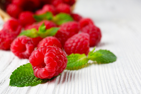 Fresh red raspberries on wooden table, closeupの写真素材