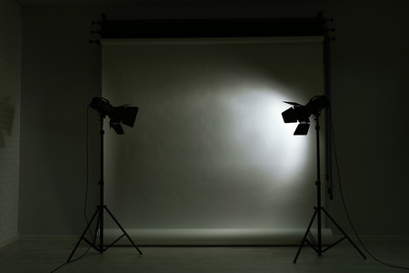 Empty photo studio with lighting equipment