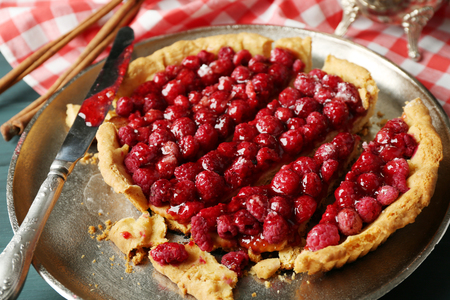 Tart with raspberries on tray, close-upの写真素材