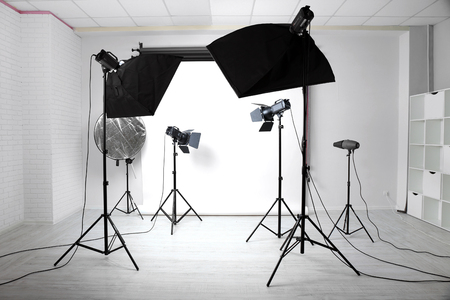 Empty photo studio with lighting equipmentの写真素材