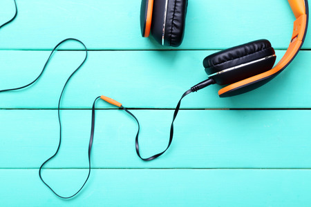 Headphones on wooden backgroundの写真素材
