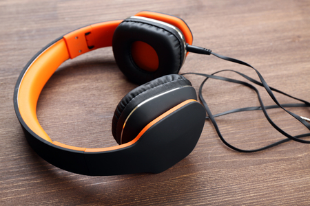 Headphones on wooden backgroundの写真素材