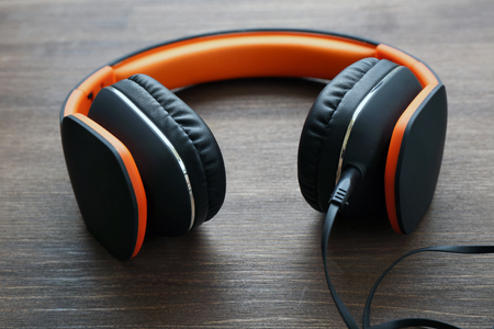 Headphones on wooden backgroundの写真素材