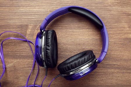 Headphones on wooden backgroundの写真素材