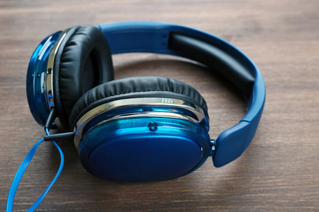 Headphones on wooden backgroundの写真素材