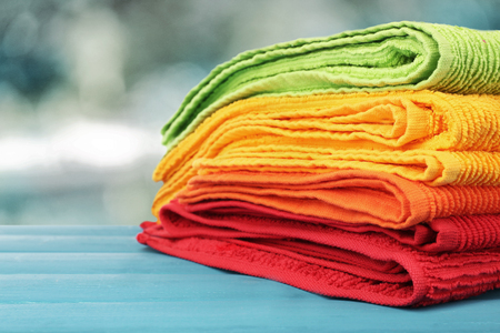 Colorful towels on blurred backgroundの写真素材
