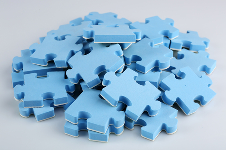 Pile of blue puzzle pieces, closeupの写真素材