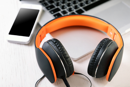 Headphones and other devices on worktop, closeupの写真素材