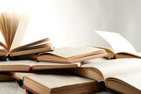 Many open books isolated on whiteの写真素材