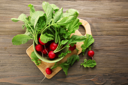 Fresh red radish on wooden backgroundの写真素材