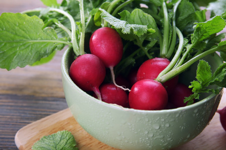 Fresh red radish on wooden table, closeupの写真素材