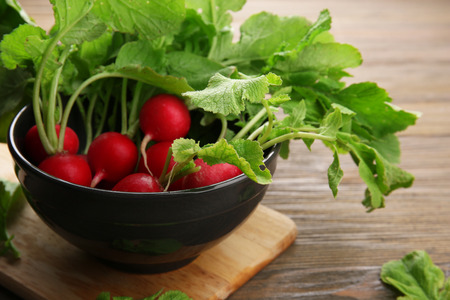 Fresh red radish on wooden table, closeupの写真素材