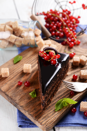 Tasty chocolate cake with berries on table close upの写真素材