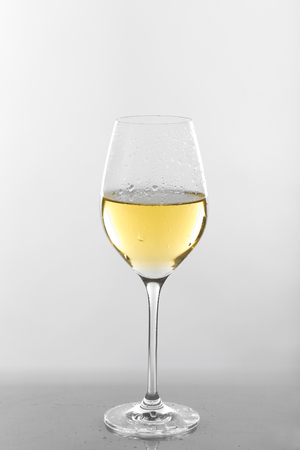 Glass of wine on grey backgroundの写真素材