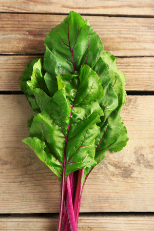 Fresh swiss chard on wooden table, close up