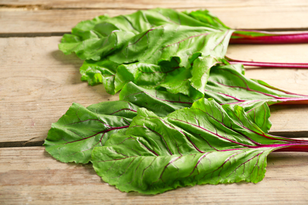 Fresh swiss chard on wooden table, close up
