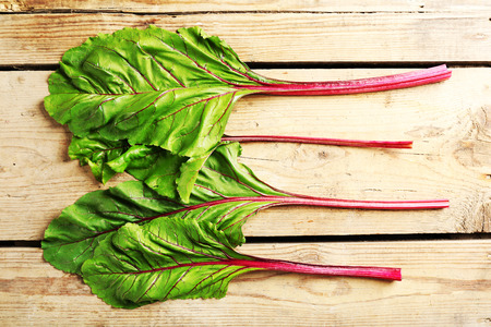 Fresh swiss chard on wooden table, close up