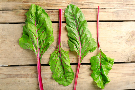 Fresh swiss chard on wooden table, close upの写真素材