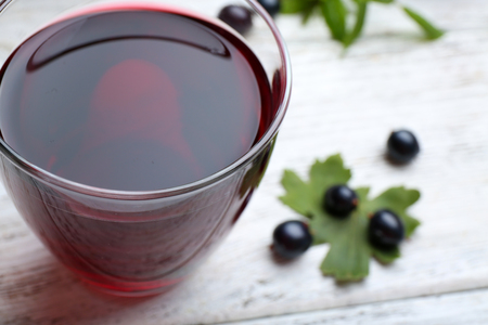 Fresh currant juice with berries on table close upの写真素材