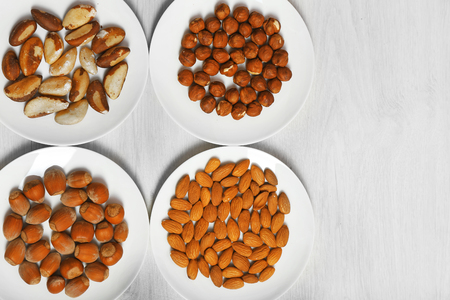 Collection of nuts on wooden backgroundの写真素材