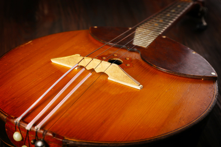 Folk musical instrument domra on wooden surface, closeupの写真素材