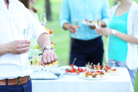 Guests drink champagne on wedding ceremonyの写真素材