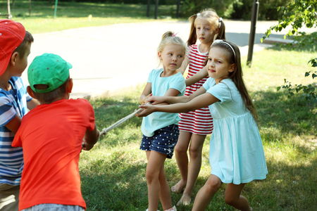 Happy active children playing in parkの写真素材