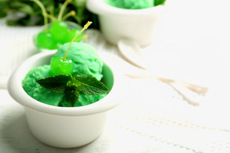 Homemade mint ice-cream on light wooden backgroundの写真素材