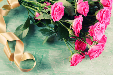 Beautiful roses on wooden backgroundの写真素材