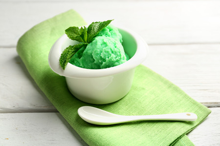 Homemade mint ice-cream on light wooden backgroundの写真素材