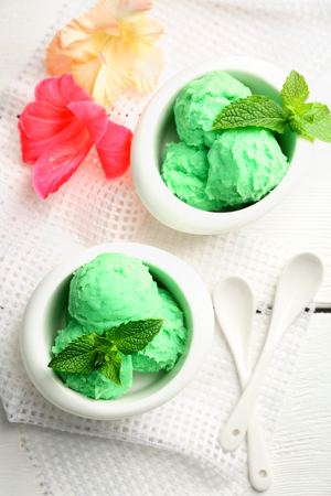 Homemade mint ice-cream on light wooden backgroundの写真素材
