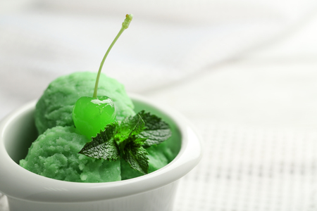Homemade mint ice-cream on light wooden backgroundの写真素材