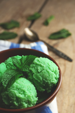 Homemade mint ice-cream on wooden backgroundの写真素材