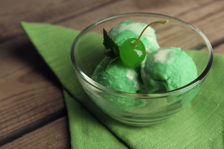 Homemade mint ice-cream on wooden backgroundの写真素材