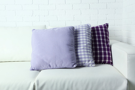 Colorful pillows on sofa, close-upの写真素材