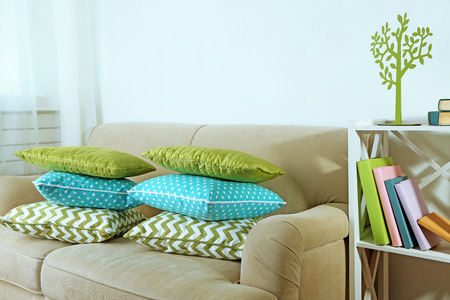 Colorful pillows on sofa, close-upの写真素材