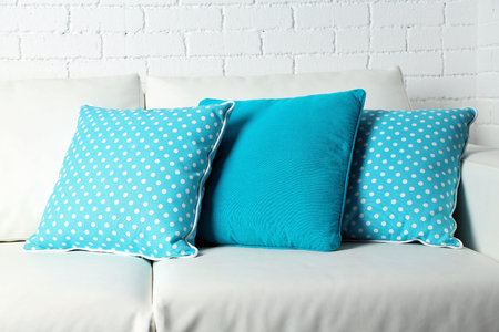 Colorful pillows on sofa, close-upの写真素材