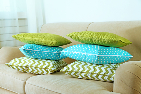 Colorful pillows on sofa, close-upの写真素材